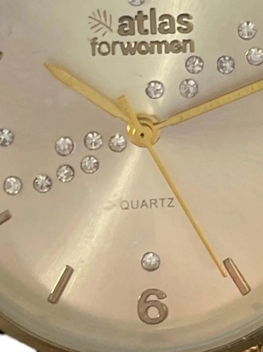 Uhren>atlas Uhr goldfarben