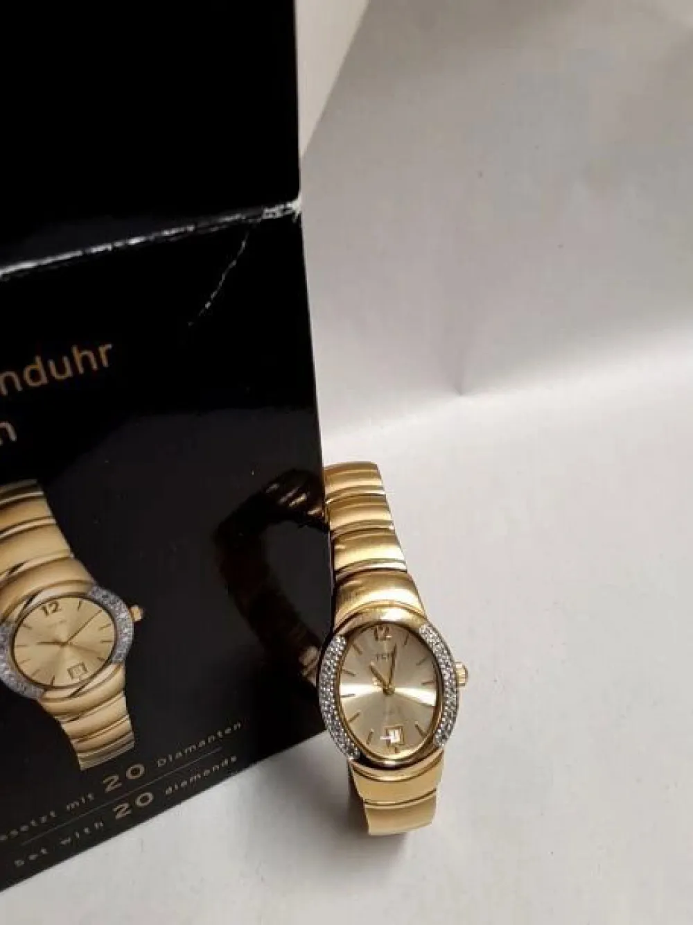 Uhren>Tchibo Uhr goldfarben